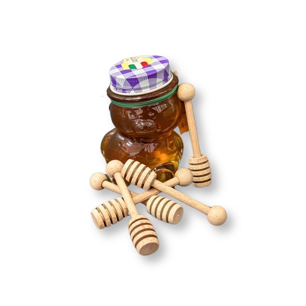 Prendimiele artigianali in legno di faggio utilizzati con barattolo di miele